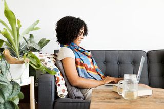 woman on laptop looking up retirement